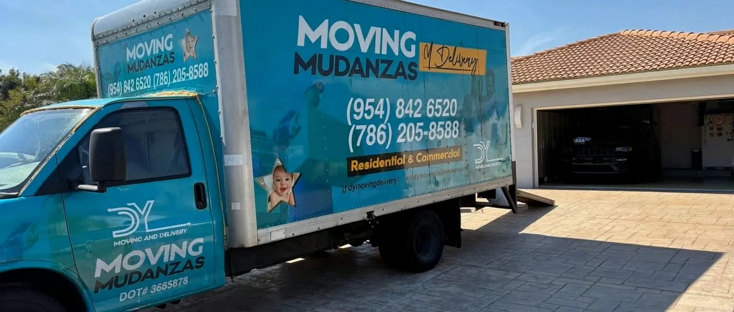 DY Moving & Delivery teal branded moving truck parked in front of a Miami home